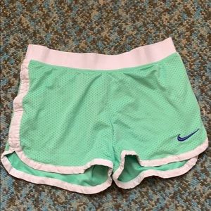 green nike shorts